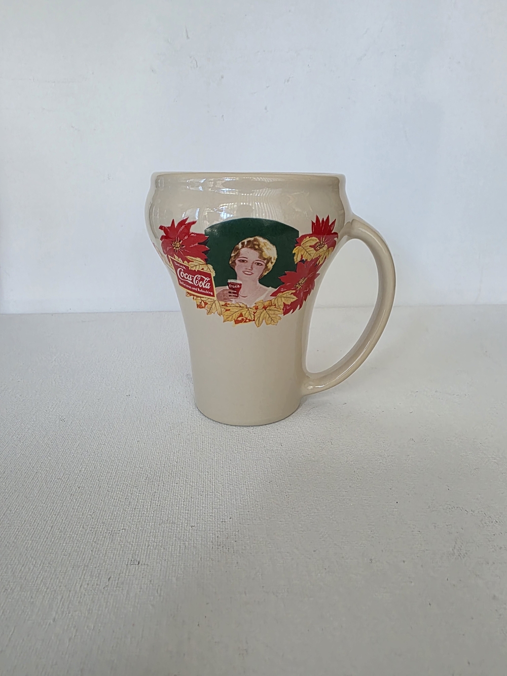 1990 Coca Cola Brand Beige Holiday Ceramic Mug.